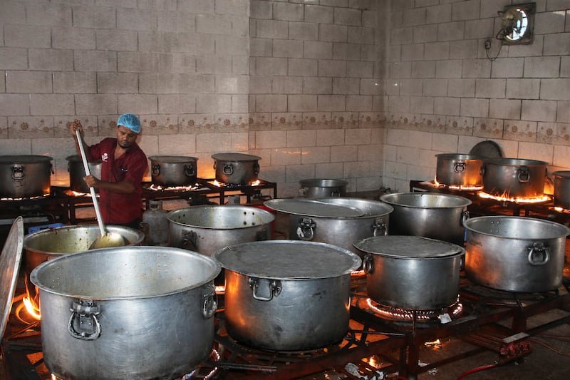A cook prepares Zurbian in Aden, Yemen. Reuters
