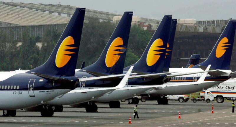 FILE PHOTO: Jet Airways aircraft stand on tarmac at the domestic airport terminal in Mumbai, India September 9, 2009. REUTERS/Punit Paranjpe/File Photo