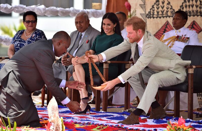 Prince Harry  receives a whale tooth necklace. Reuters