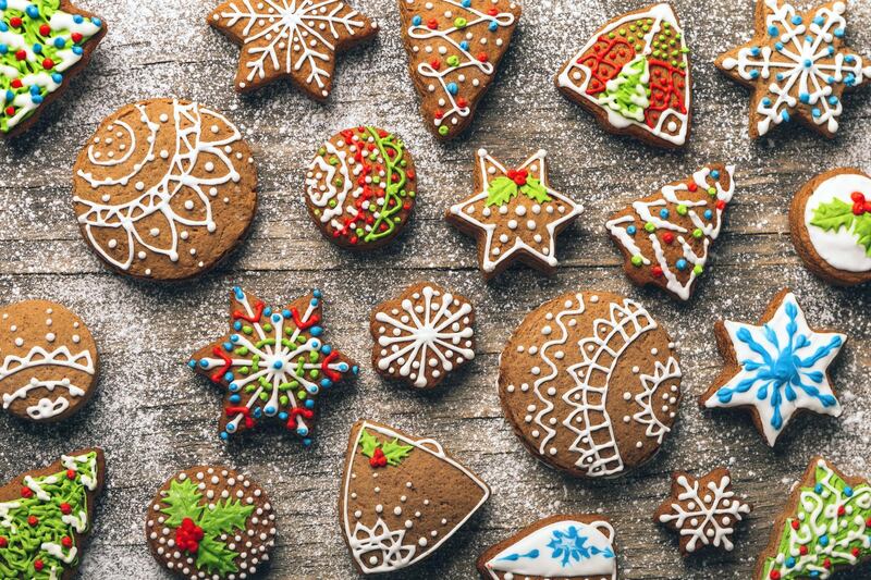 Christmas gingerbread cookies on wooden table with sugar