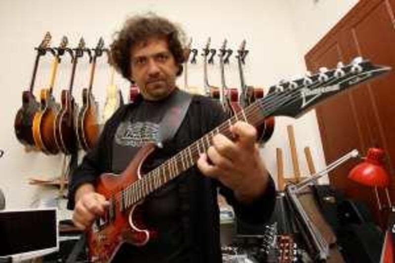 DUBAI, UNITED ARAB EMIRATES, May 6: Kamal Musallam, Musician and Producer with his arabic guitar in his studio at Al Nahda area in Dubai. (Pawan Singh / The National) For News.