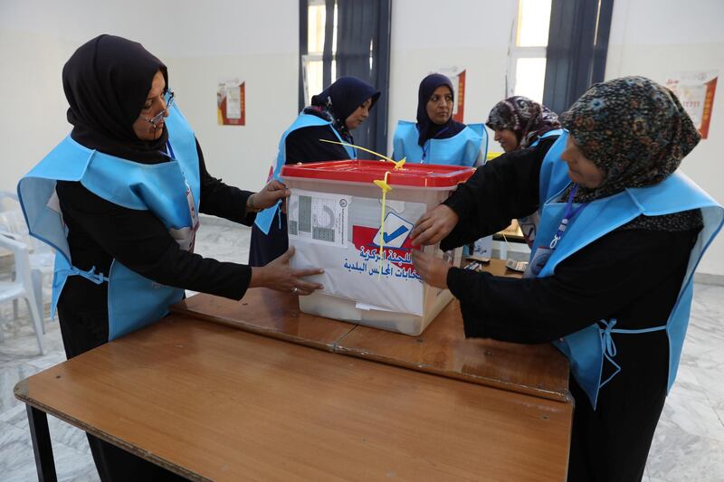 Members of the Central Committee for Municipal Elections take part in an election simulation at a school in Tripoli. Photo: Reuters