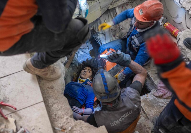 Emergency personnel conduct a rescue operation to save Melda, 16, from beneath the rubble of a collapsed building in Hatay, southern Turkey. AFP