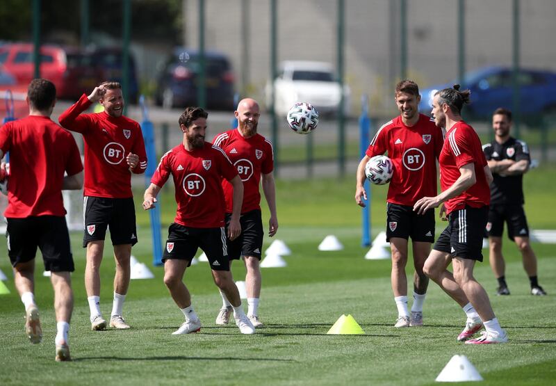 Wales' Joe Allen passes to Gareth Bale during training session. PA