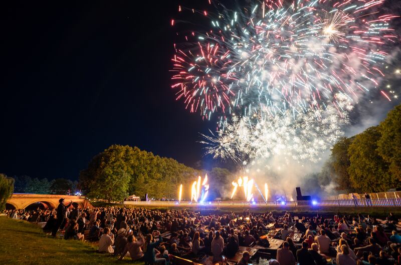 Students watch a firework display at the Trinity May Ball at the University of Cambridge's Trinity College On Monday evening. The ball celebrates the end of the academic year. PA