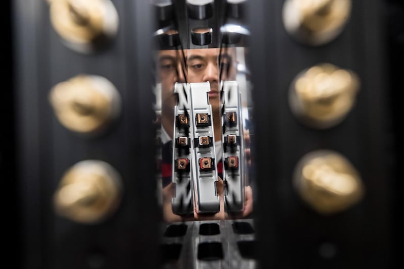 An employee installs a Lithium-ion battery cell into a testing system in this arranged photograph taken at the Powervault Ltd. office in London, U.K., on Wednesday, Jun. 13, 2018. Powervault is among companies helping to recycle lithium-ion car and bus batteries for another seven to 10 years after being taken off the roads and stripped from chassis -- a shelf life with significant ramifications for global carmakers, electricity providers and raw-materials suppliers. Photographer: Simon Dawson/Bloomberg