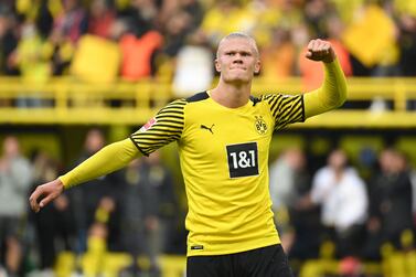 (FILES) In this file photo taken on October 16, 2021 Dortmund's Norwegian forward Erling Braut Haaland celebrates scoring his team's third goal during the German first division Bundesliga football match BVB Borussia Dortmund v Mainz 05 in Dortmund, western Germany.  - Manchester City said Tuesday, May 10, they had reached an agreement in principle with Borussia Dortmund to sign striker Erling Haaland.  (Photo by Ina Fassbender  /  AFP)