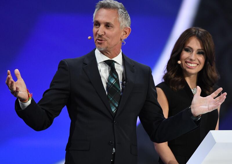 England's former forward and draw conductor Gary Lineker and Russian sports journalist and draw conductor Maria Komandnaya conduct the 2018 FIFA World Cup football tournament final draw at the State Kremlin Palace in Moscow on December 1, 2017.
The 2018 FIFA World Cup will be held between June 14 and July 15, 2018 in 11 Russian cities. / AFP PHOTO / Yuri KADOBNOV