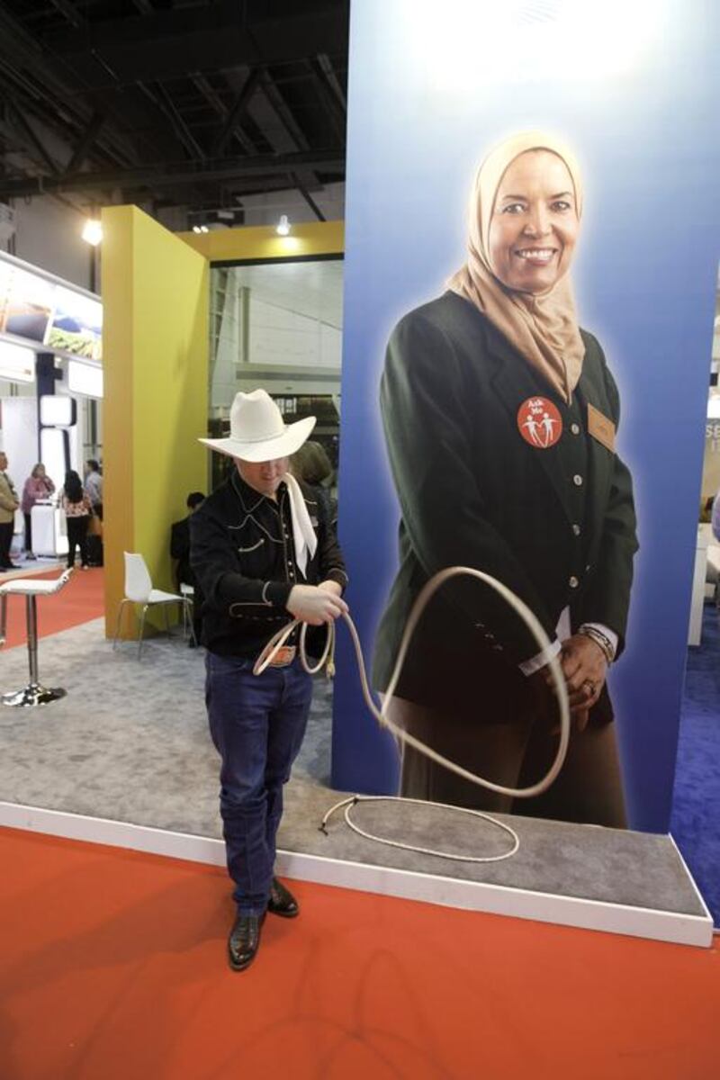 A rodeo performs a rope trick show at the USA stand during the Arabian Travel Market. Jaime Puebla / The National