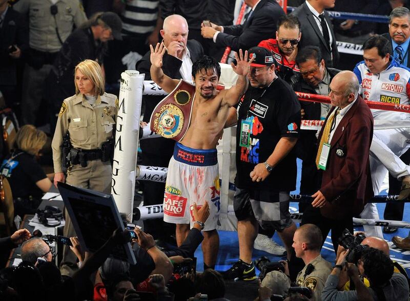 Eventually, Pacquiao won on unanimous decision, righting one of the biggest perceived wrongs in recent boxing history. David Becker / Getty Images