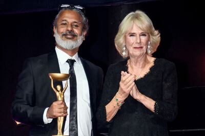 Shehan Karunatilaka poses next to Britain's Camilla, Queen Consort, after winning the British Booker Prize for his novel 'The Seven Moons of Maali Almeida' on Monday. AFP