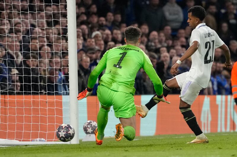 Real Madrid's Rodrygo scores his side's second goal past Chelsea goalkeeper Kepa Arrizabalaga in the Champions League quarter-final second leg at Stamford Bridge on Tuesday, April 18, 2023. AP 