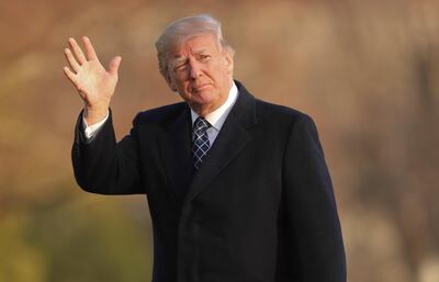 U.S. President Donald Trump waves as he walks across the South Lawn of the White House in Washington, Sunday, March 25, 2018, after returning from his Mar-a-Lago estate in Palm Beach, Fla. (AP Photo/Pablo Martinez Monsivais)