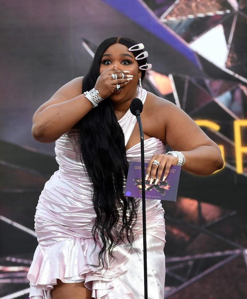 US rapper Lizzo announces the Best New Artist award onstage during the 63rd Annual Grammy Awards. Getty Images