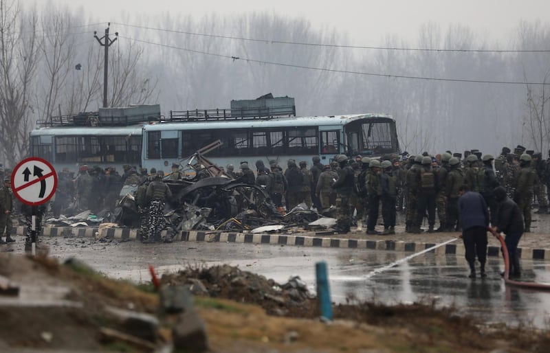 Indian security men inspect at the site blast in Lethpora area of south Kashmir' s Pulwama district some 20 kilometers from Srinagar, the summer capital of Indian Kashmir. At least 18 Indian paramilitary Central Reserve Police Force (CRPF) personnel were killed in a suicide attack in Pulwama district when a militant rammed an explosive-laden vehicle into the CRPF bus they were travelling in, according to local news reports.  EPA
