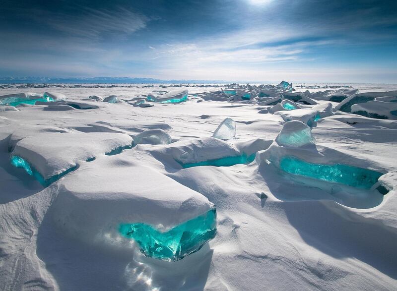 'Baikal Treasure', Alexey Trofimov: 'I took this photo during an expedition on the ice of Lake Baikal [Russia]. On the first day we arrived at Cape Kotelnikovsky, where I was attracted by ice hummocks and a snow cover. It was noon, not really my photo time. But the light that the sun gave, refracting in blocks of ice, caught my attention and made me take this picture.'
