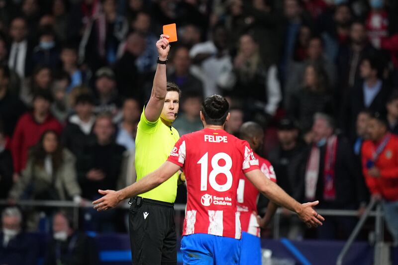 Referee Daniel Siebert gives Felipe of Atletico Madrid a red card. Getty