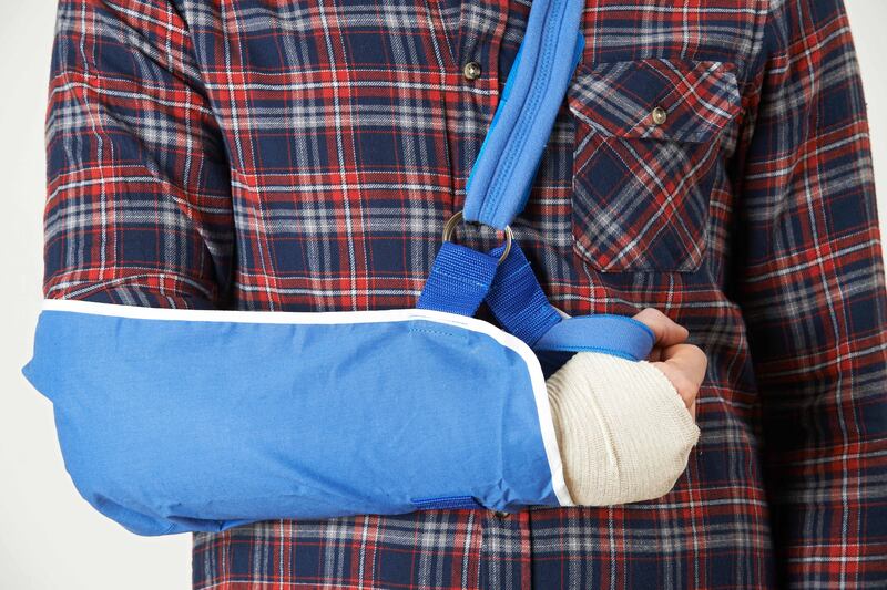 EN54HK Close Up Of Young Man With Arm In Sling. Alamy