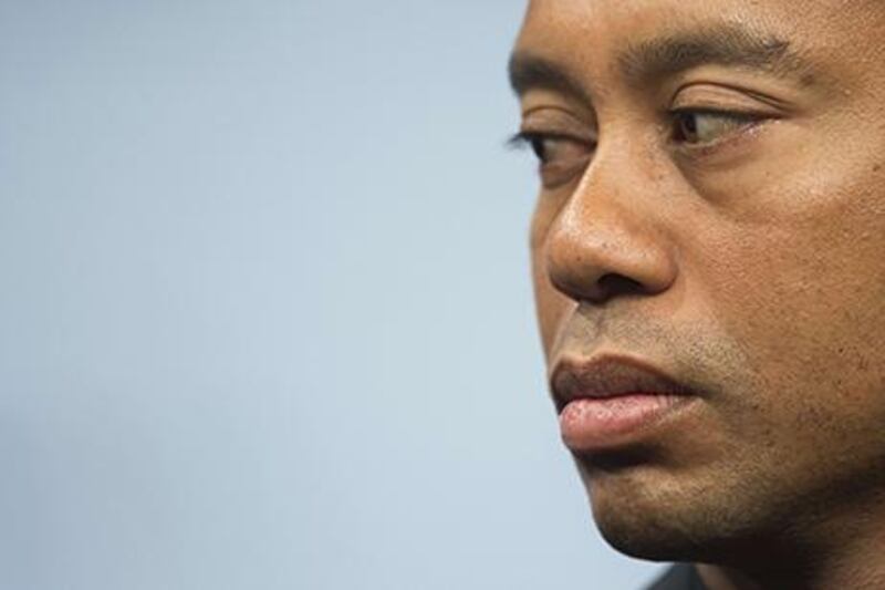 Tiger Woods has a back injury that could limit his golfing career. Jim Watson / AFP