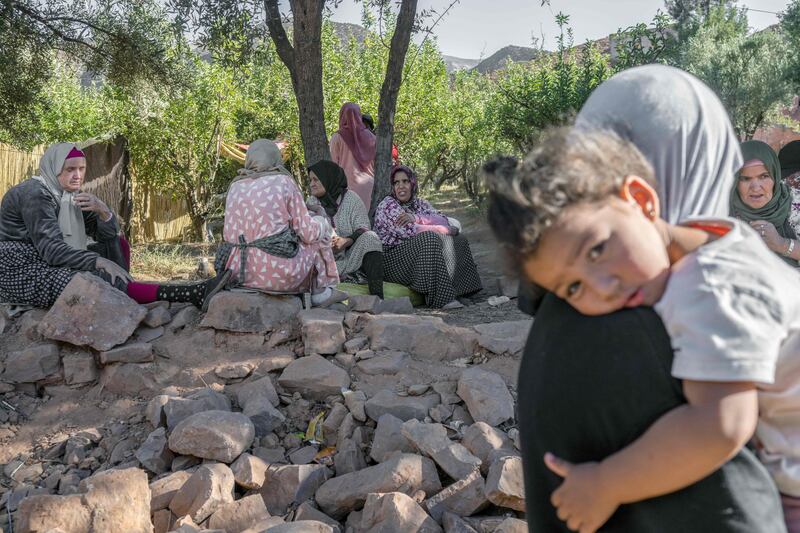 A makeshift camp is set up in the open. AFP