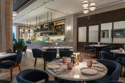 The Abu Dhabi outpost has a glass-fronted terrace and an open kitchen. Photo: Le Bistro by Salmontini