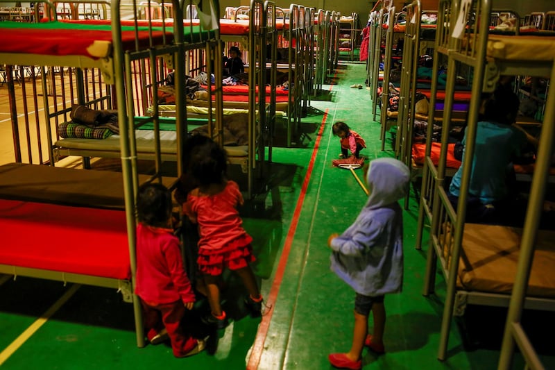 Asylum-seeking migrant girls from Central America, who were expelled from the U.S. and sent back to Mexico with their families under Title 42, play near bunk beds inside the "Kiki Romero" temporary migrant shelter, in Ciudad Juarez, Mexico April 20. Reuters