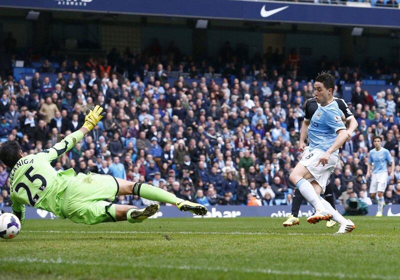 Manchester City midfielder Samir Nasri scores his side's second goal against Southampton on Saturday. Darren Staples / Reuters / April 5, 2014
