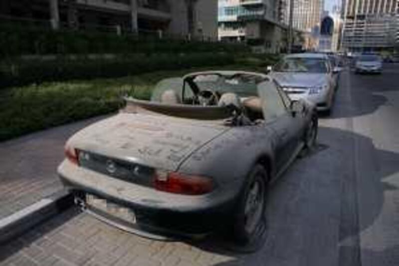 Dubai, 31st August 2009.  An abandoned BMW Z3 at Dubai Marina area.  (Jeffrey E Biteng / The National)  Editor's Note; Hugh N reports. *** Local Caption ***  JB23-Acars.jpg