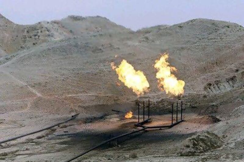Gas is flared off oil wells in Iran. AP Photo