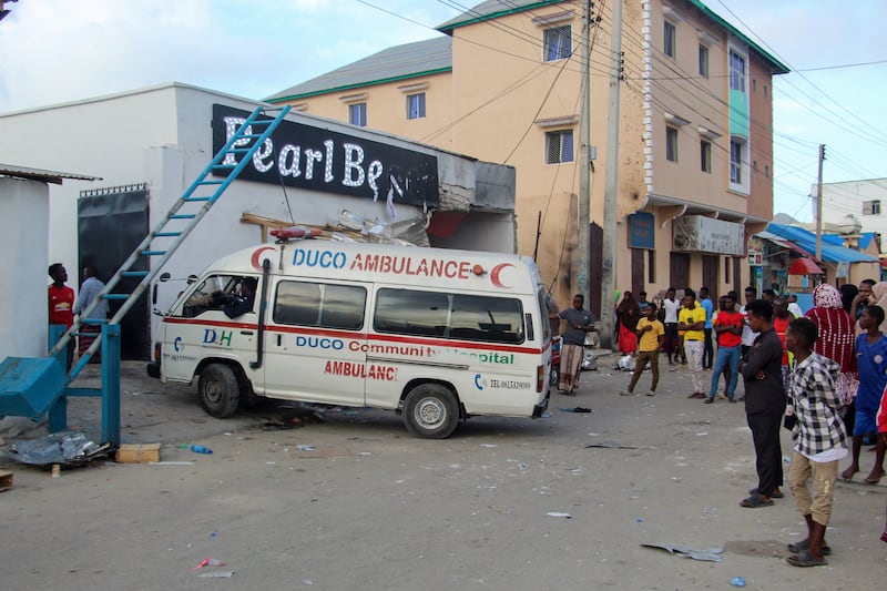 Emergency services arrive at the Pearl Beach Hotel in Lido Beach, Mogadishu, after the fighting between state security forces and Al Shabab extremists. EPA 