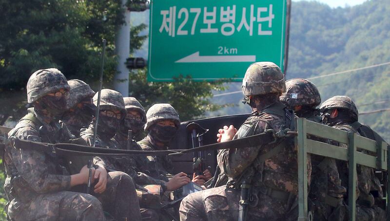 South Korean soldiers ride on a military truck in the border county of Hwacheon on September 4, 2017.
The South Korean military said on September 4, it conducted a ballistic missile exercise of a simulated attack on the North's nuclear test site, in response to Pyongyang's sixth nuclear test a day earlier. / AFP PHOTO / YONHAP / STR /  - South Korea OUT / NO ARCHIVES -  RESTRICTED TO SUBSCRIPTION USE