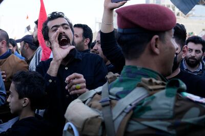 A man shouts at the funeral of the slain militia leader in Baghdad on Thursday. AP Photo