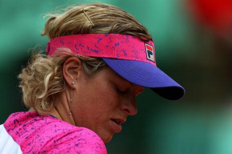 Kim Clijsters threw away two match points against Aranxta Rus and exited the French Open at the second round after the Dutchwoman won their match 3-6, 7-5, 6-1.