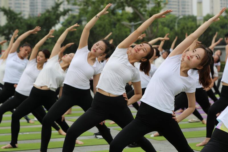 People practice yoga in Xiangyang, China. Reuters