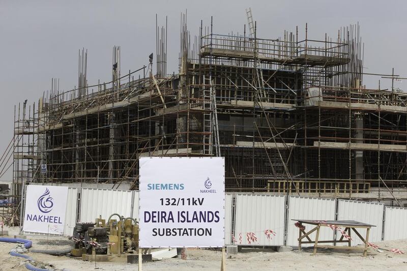 Above, construction of Nakheel's Deira Islands project in Dubai. Christopher Pike / The National