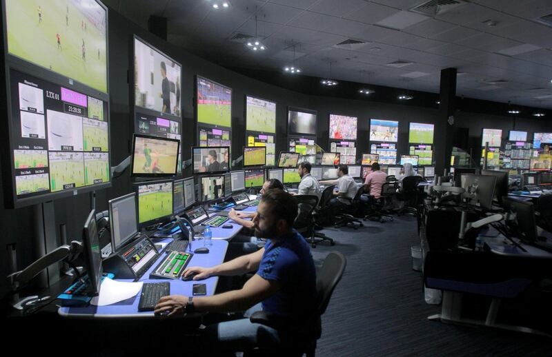 FILE PHOTO: Employees work in a broadcast control room at the beIN Sports studio that will be hosting the 2022 FIFA World Cup in Doha, Qatar October 16, 2018.REUTERS/Naseem Zeitoon/File Photo