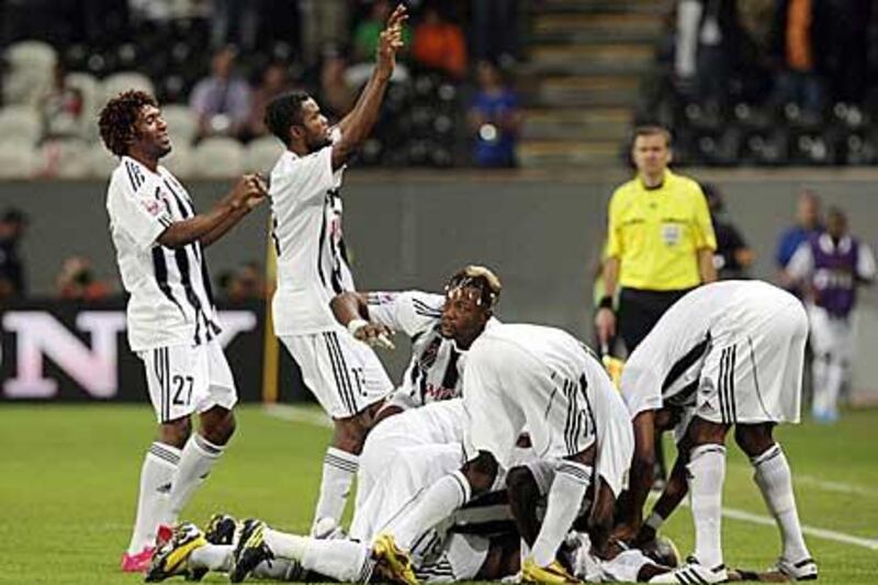 Mazember players celebrate after their shock win over Internacionale at Mohammed bin Zayed stadium in Abu Dhabi.