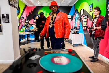 Curtis Fisher, aka Grandmaster Caz looks at Hip-Hop memorabilia at the Hip-Hop Museum Pop Up Experience in Washington, DC AFP / ANDREW CABALLERO-REYNOLDS 