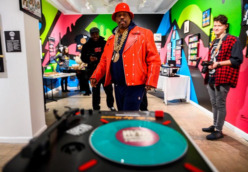 (FILES) In this file photo taken on January 19, 2019 Curtis Fisher, aka Grandmaster Caz looks at Hip-Hop memorabilia at the Hip-Hop Museum Pop Up Experience in Washington, DC.  Forty years ago, hip-hop was little known outside its birthplace New York -- until the Sugarhill Gang decided to record their rhymes, launching the genre's rise as a dominant cultural and commercial force. / AFP / ANDREW CABALLERO-REYNOLDS / TO GO WITH AFP STORY by Leo MOUREN, "Hip hop turns 40 -- and its parents are beaming with pride"
