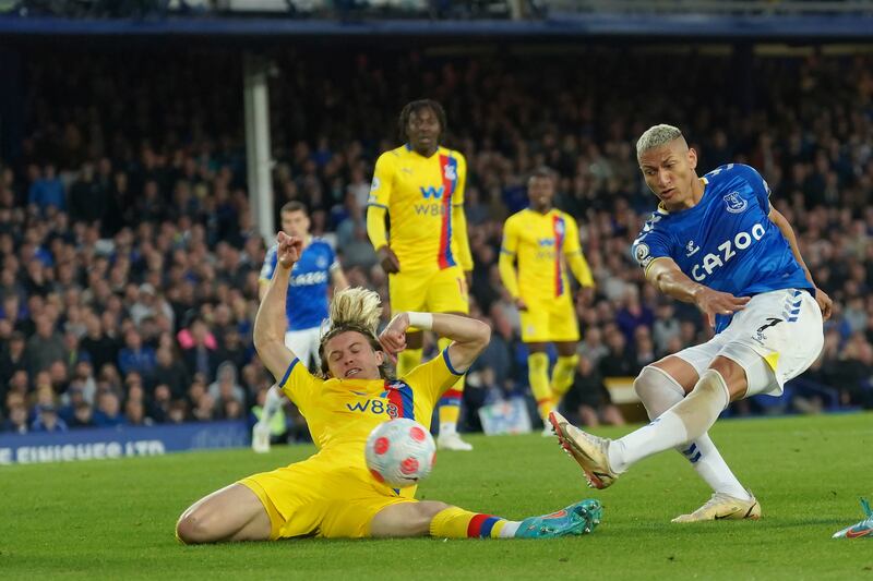 Everton's Richarlison scores against Christal Palace during the English Premier League match at Goodison Park in Liverpool, England, Thursday, May 19, 2022. AP Photo