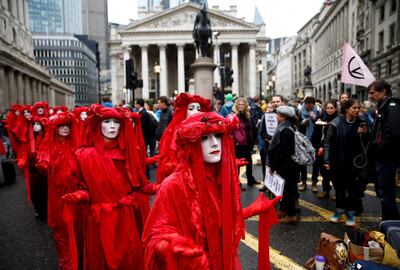 "Red Brigade" activists walk during an Extinction Rebellion demonstration, in London, Britain October 14, 2019.  REUTERS/Henry Nicholls