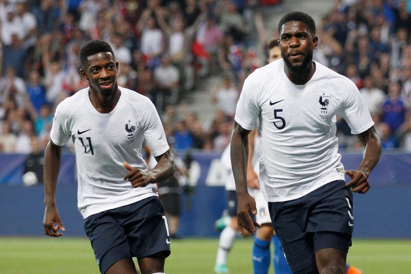 France's Samuel Umtiti, right, celebrates scoring the opening goal with his teammate Ousmane Dembele during a friendly soccer match between France and Italy at the Allianz Riviera stadium in Nice, southern France, Friday, June 1, 2018. (AP Photo/Claude Paris)