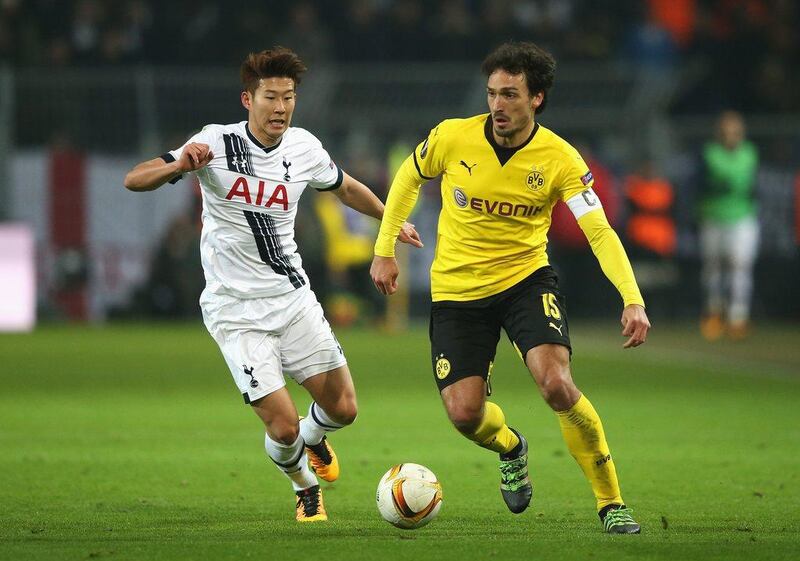 Mats Hummels of Borussia Dortmund is chased by Son Heung-min of Tottenham Hotspur during the UEFA Europa League Round of 16 first leg match between Borussia Dortmund and Tottenham Hotspur at Signal Iduna Park on March 10, 2016 in Dortmund, Germany. (Photo by Lars Baron/Bongarts/Getty Images) 