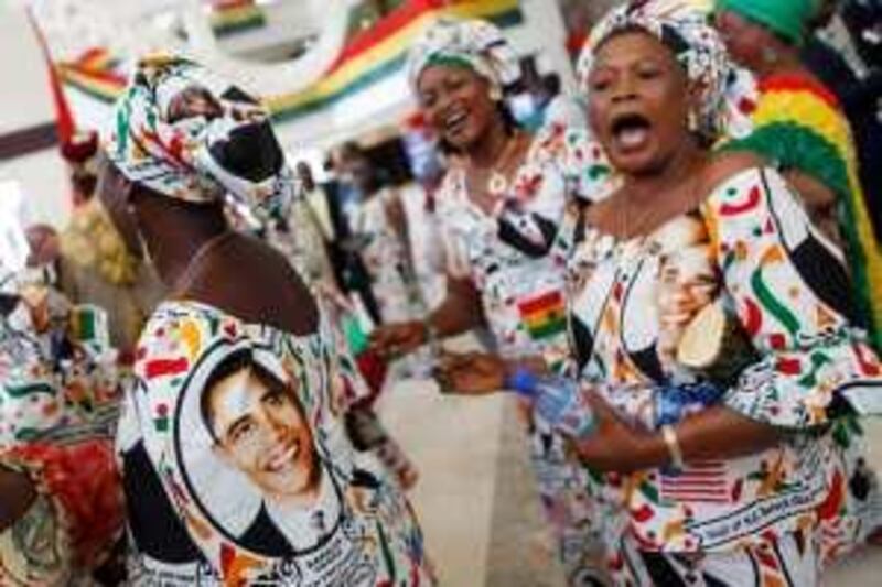 Women wearing traditional dresses bearing the image of President Barack Obama chant his name after he addressed the Ghanaian Parliament in Accra, Ghana, Saturday, July 11, 2009. (AP Photo/Charles Dharapak) *** Local Caption ***  GHAD118_Obama_Ghana.jpg