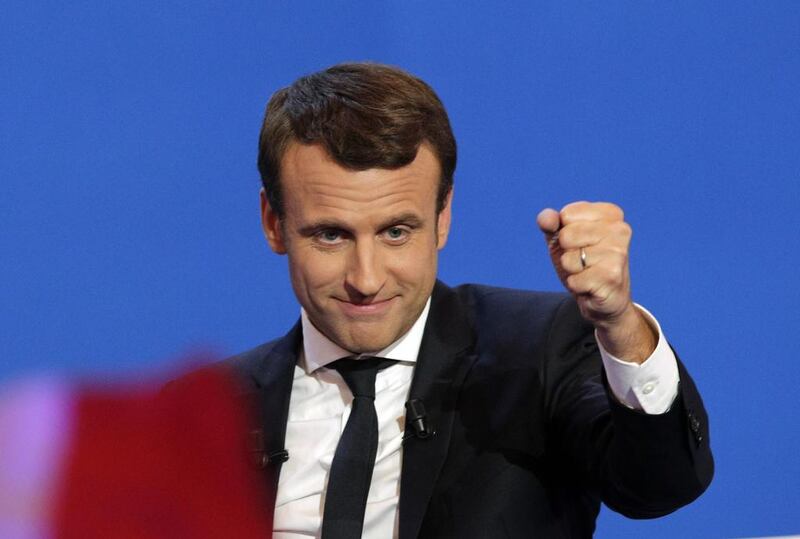 French centrist presidential candidate Emmanuel Macron clenches his fist as he addresses his supporters at his election day headquarters in Paris. Christophe Ena / AP Photo