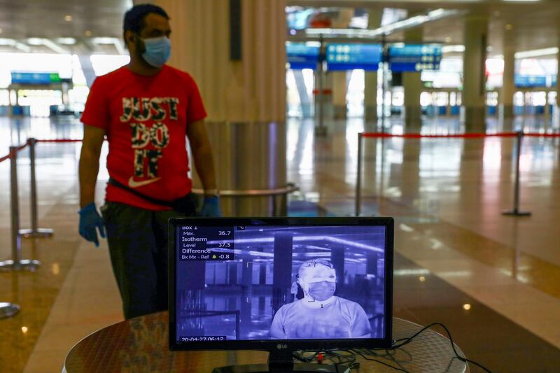 A man is seen through a thermal camera at Dubai International Airport, as Emirates airline resumed limited outbound passenger flights amid the coronavirus outbreak.