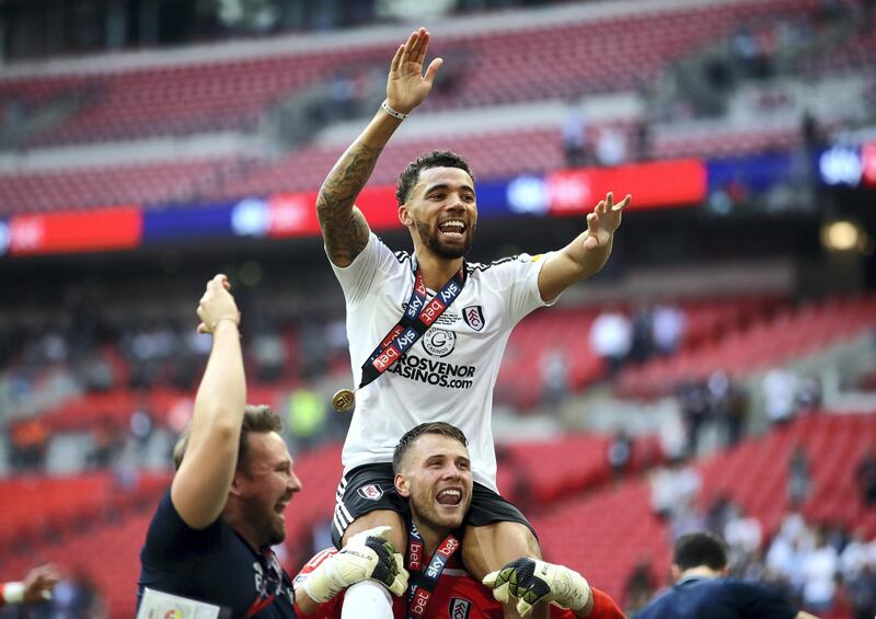 LONDON, ENGLAND - MAY 26:  Ryan Fredericks of Fulham celebrates with Marcus Bettinelli of Fulham following their sides victory in the Sky Bet Championship Play Off Final between Aston Villa and  Fulham at Wembley Stadium on May 26, 2018 in London, England.  (Photo by Clive Mason/Getty Images)