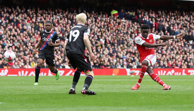 Bukayo Saka scores Arsenal's fourth goal. Reuters