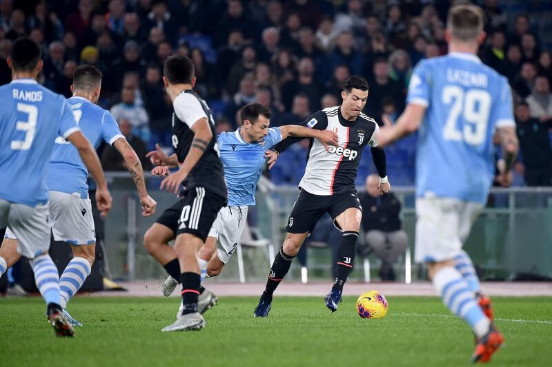 Juventus' Portuguese forward Cristiano Ronaldo outruns Lazio's Romanian defender Stefan Radu. AFP