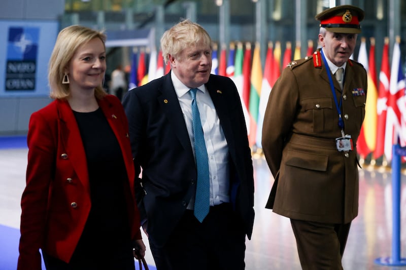 From left, Foreign Secretary Liz Truss, British Prime Minister Boris Johnson and military representative to Nato Ben Bathurst leave Nato Headquarters following a summit on Russia's invasion of Ukraine. Getty Images